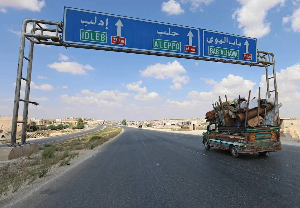 Residents of the Idlib province flee toward the Syrian Turkish border on September 10, 2018. (AFP)