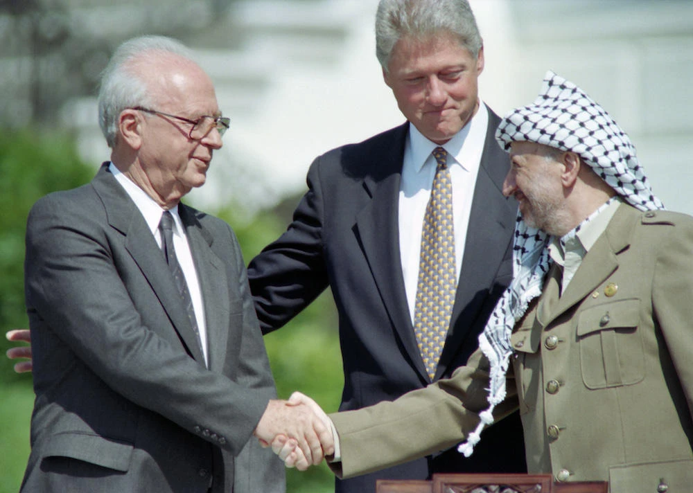 Israeli prime minister Yitzhak Rabin and Palestinian leader Yasser Arafat sealed the first Oslo agreement with a handshake on the White House lawn. (File Photo / AFP)