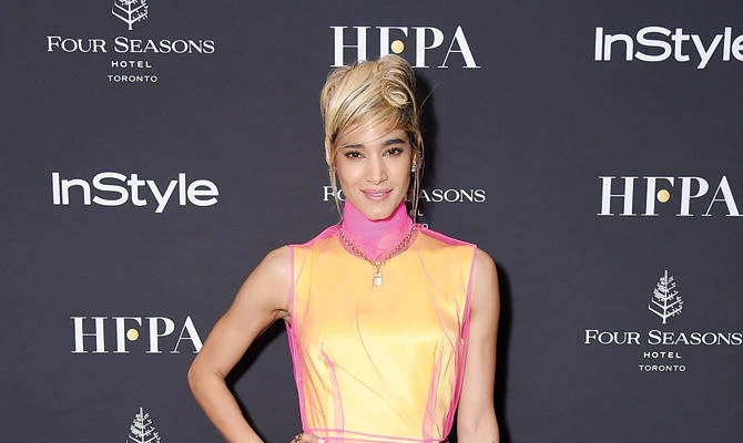 Sofia Boutella poses on the black carpet during another event in Toronto. (AFP)