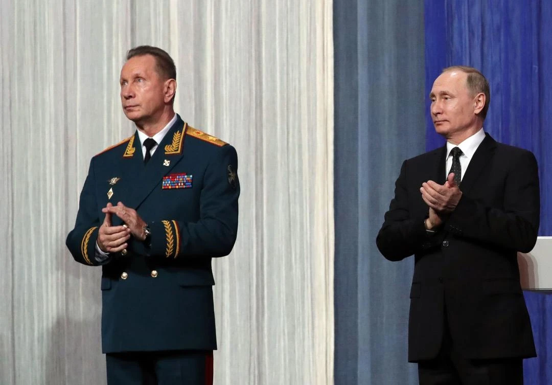 In this file photo taken on March 27, 2017 Russian President Vladimir Putin (R) and the National Guard chief Viktor Zolotov take part in a gala evening marking the Day of Russia's National Guard in Moscow. (AFP)