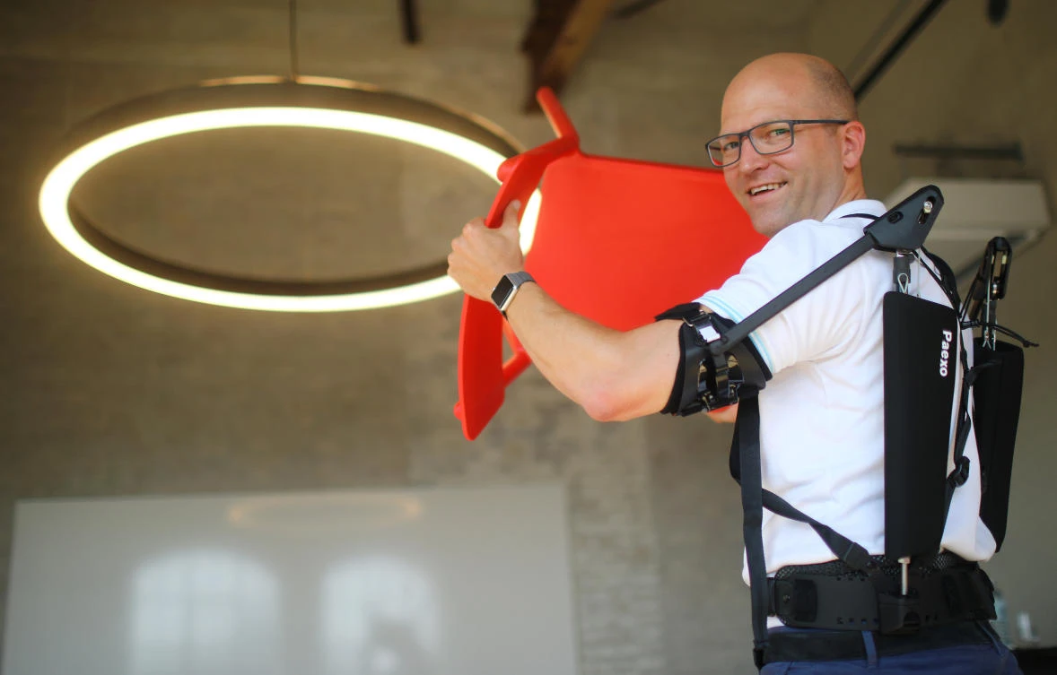 Soenke Rossing of German prosthetic limb maker Ottobock, presents an exoskeleton during an interview in Berlin. (Reuters)