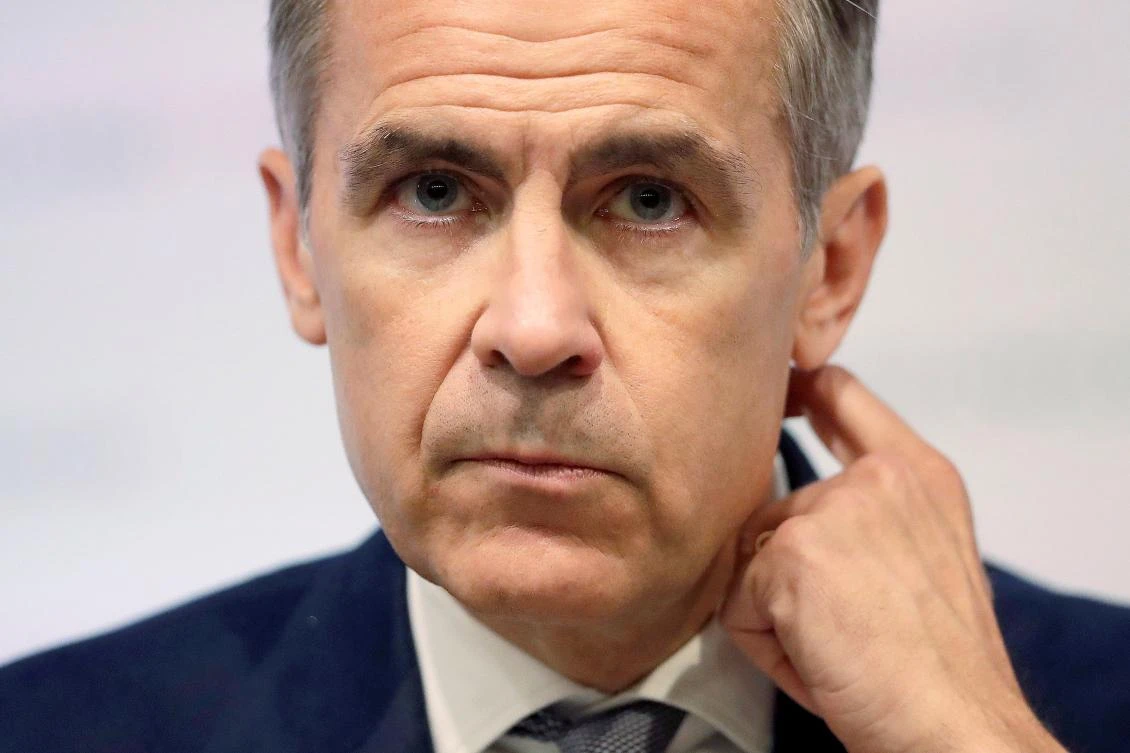In this file photo taken on June 27, 2018 Bank of England Governor Mark Carney attends the Bank of England's financial stability report at the Bank of England in central London. Mark Carney will remain Bank of England chief until January 2020 to steer the UK economy through possibly "quite a turbulent period" post-Brexit, finance minister Philip Hammond announced on September 11, 2018. (AFP)