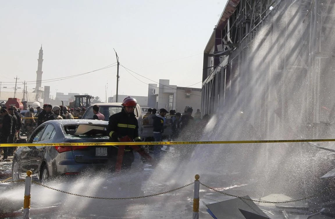 Iraqi firefighters extinguish fire at the site of a car bomb attack at a garage in the capital Baghdad on January 24, 2017. (File/ AFP)
