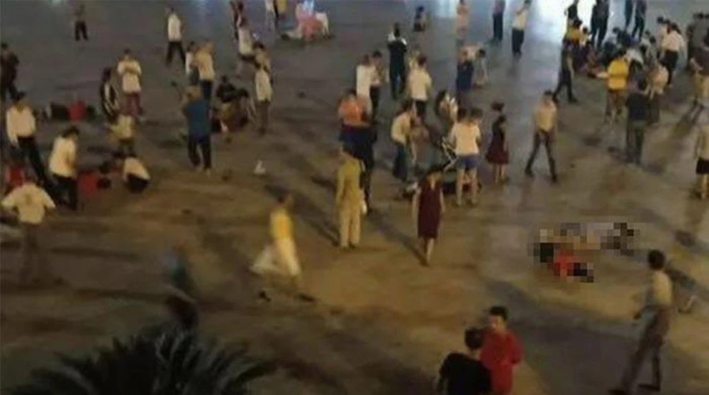 Blurred images of stricken people lie in a square in Hengyang city, after they were run over by a vehicle. (Twitter)
