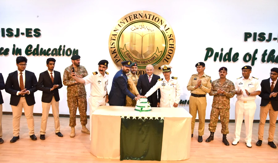 Officers of the Pakistan army, navy and air force and Principal Adnan Nasir cut a cake during the ceremony. (Photo/Supplied)
