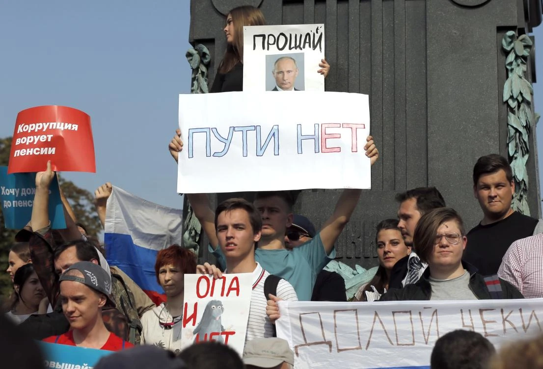 In this Sunday, Sept. 9, 2018 file photo, protesters hold posters that read: "Goodbye", top, and "No Way", during a rally in Moscow, Russia. (File/AP)