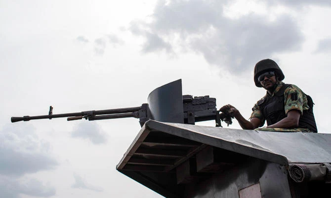 In this file photo taken on April 17, 2018 a member of the Nigerian Military Police sits on an armoured vehicle during the African Land Forces Summit (ALFS) military demonstration held at General Ao Azazi barracks in Gwagwalada. (AFP)