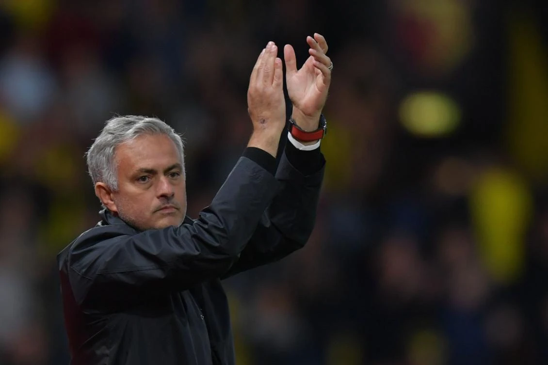 Manchester United's Portuguese manager Jose Mourinho applauds fans after winning the English Premier League football match between Watford and Manchester United at Vicarage Road Stadium in Watford. (AFP)