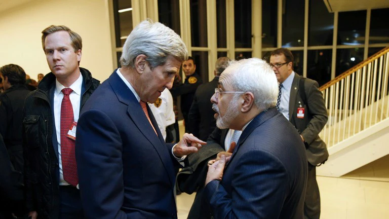 ormer US Secretary of State John Kerry (left), shown in this file photo with Iranian Foreign Minister Mohammad Javad Zarif, has been accused of trying to undermine the Trump administration's policy on Iran by meeting several times recently with the top Iranian diplomat.