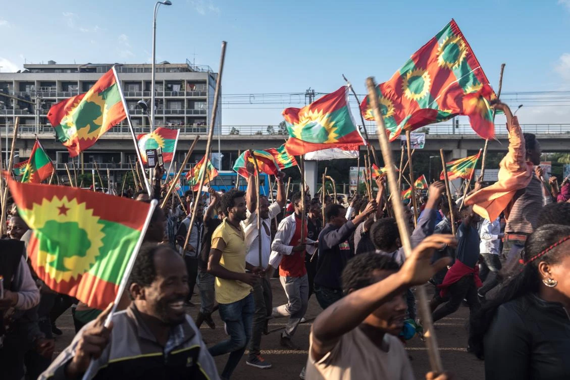 People celebrate ahead of the return of the formerly banned anti-government group, the Oromo Liberation Front (OLF), in the Ethiopian capital Addis Ababa on September 14, 2018. (AFP)