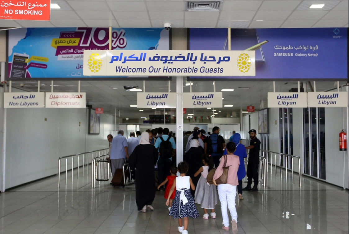 Travellers arrive at the Mitiga International Airport after its reopening on September 7, 2018, in the Libyan capital of Tripoli. / AFP / Mahmud TURKIA