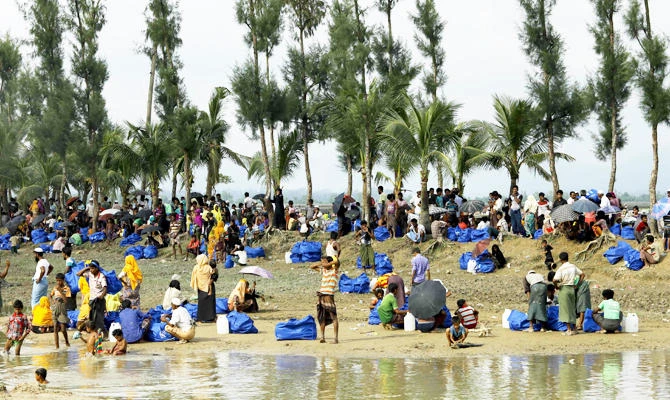 In this file photo taken on September 04, 2017 displaced Rohingya refugees from Rakhine state in Myanmar rest near Ukhia, at the border between Bangladesh and Myanmar, as they flee violence. (AFP)