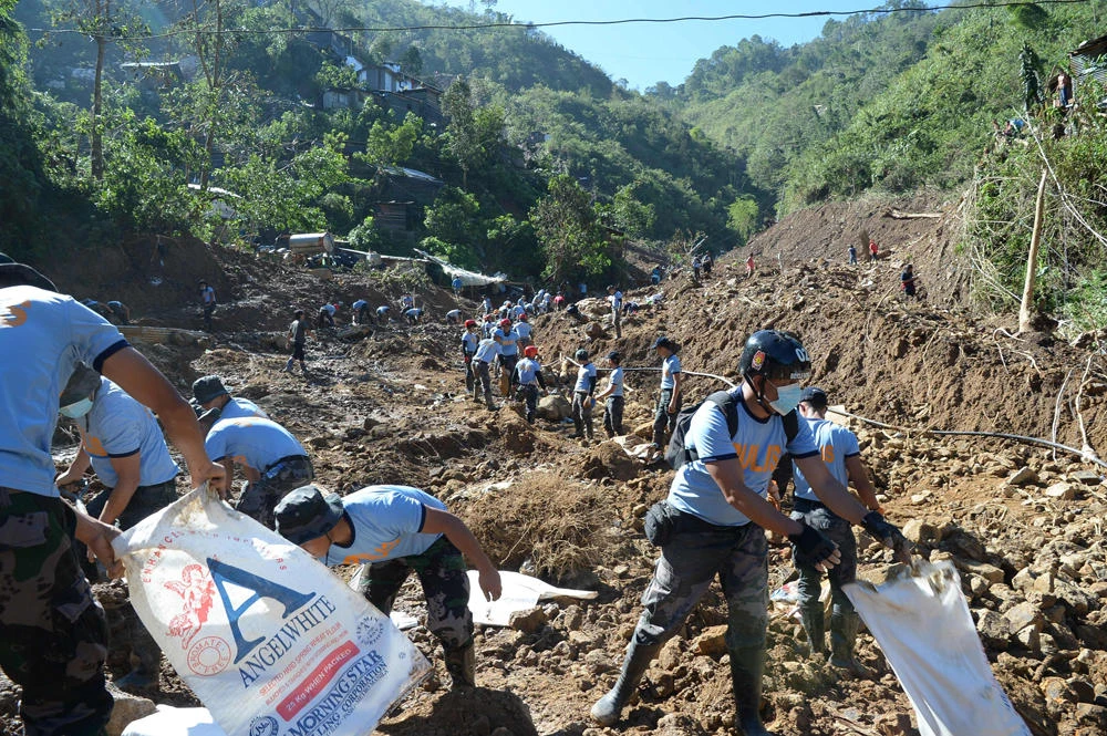 Hope fades in Philippines for dozens buried in landslides