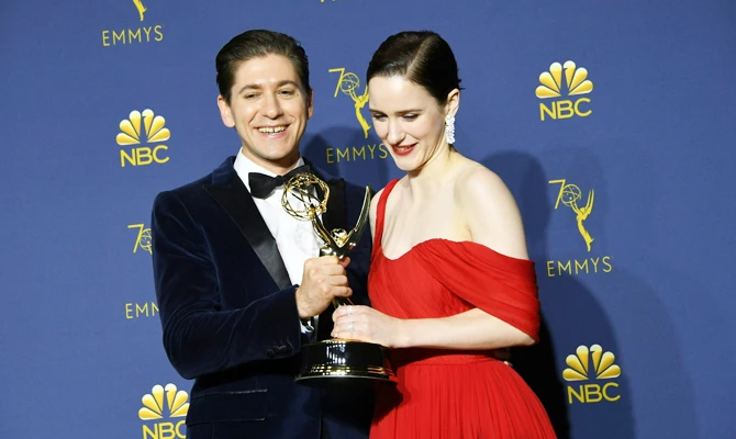 Lead actress in a comedy series winner Rachel Brosnahan and Michael Zegen pose with the Emmy during the 70th Emmy Awards at the Microsoft Theatre in Los Angeles, California on September 17, 2018. (AFP)