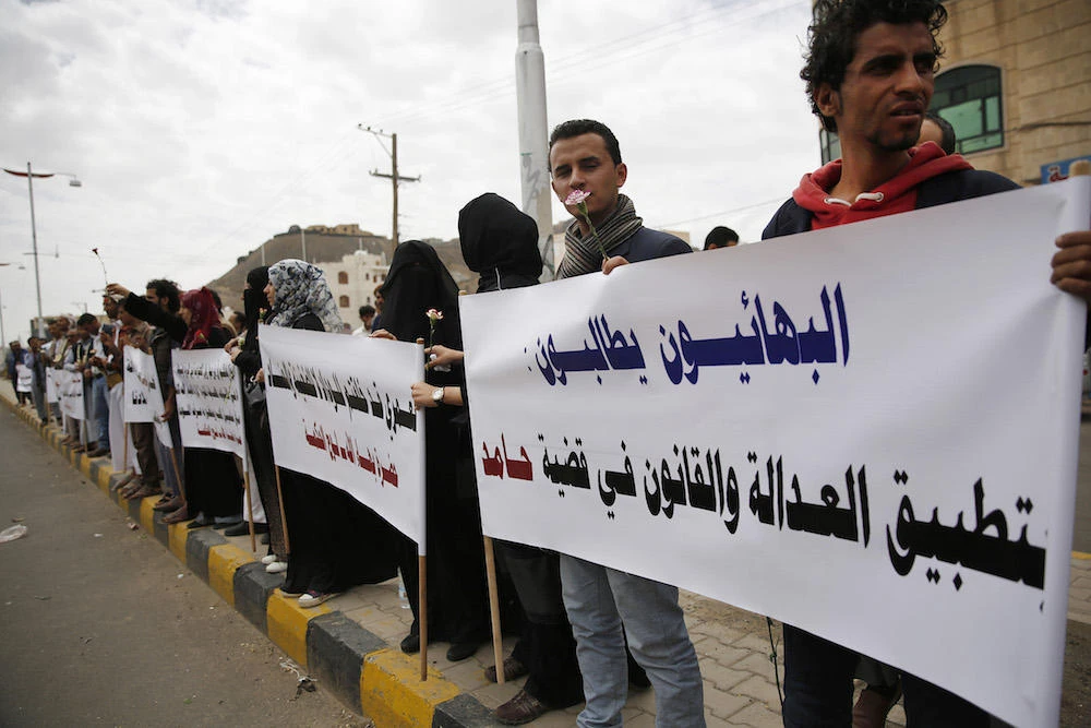 Members of the Baha’i faith protest outside a state security court in Sanaa, Yemen. (File photo / AP)