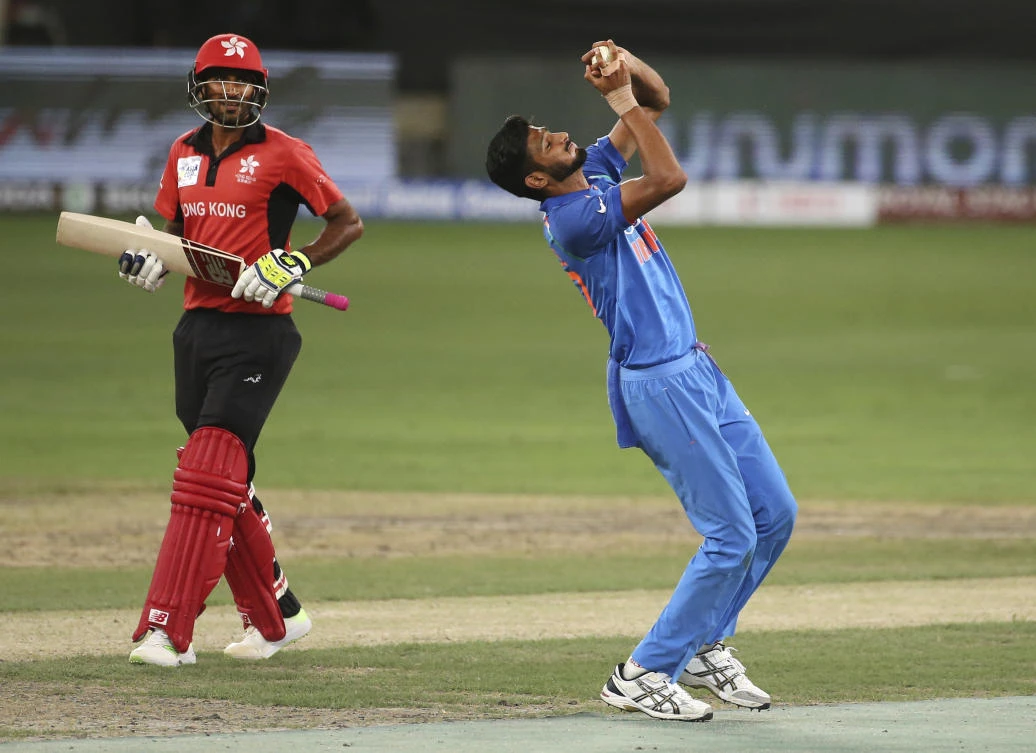 India’s Khaleel Ahmed, right, takes the catch to dismiss Hong Kong’s Ehsan Khan during their Asia Cup encounter in Dubai. (AP Photo)