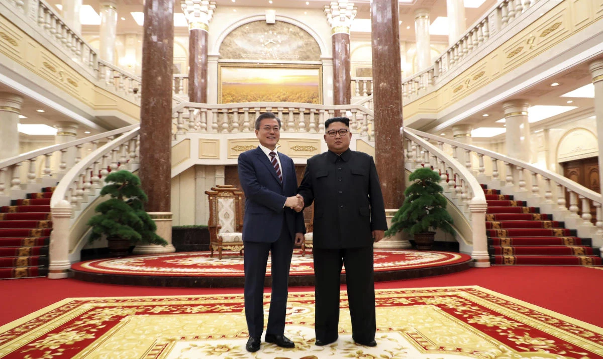 North Korean leader Kim Jong Un, right, shakes hands with South Korean President Moon Jae-in before their summit at the headquarters of the Central Committee of the Workers’ Party in Pyongyang, North Korea, Tuesday, Sept. 18, 2018. (Pyongyang Press Corps Pool via AP)