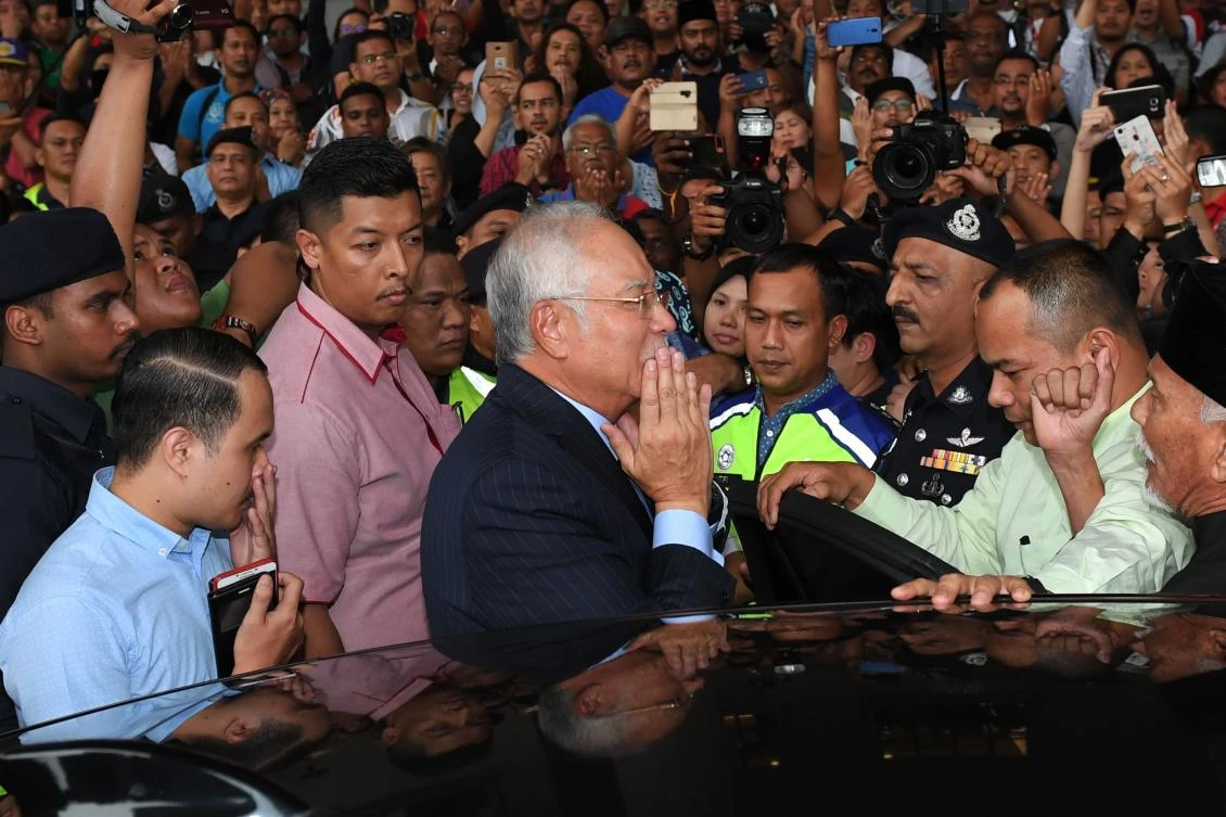 Former Malaysian PM charged with money laundering, abuse of power