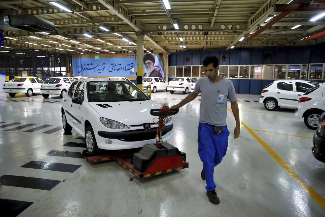 More than 100,000 people are employed by Iran-Khodro and SAIPA, while another 700,000 Iranians work in industries related to car manufacturing. (AP)