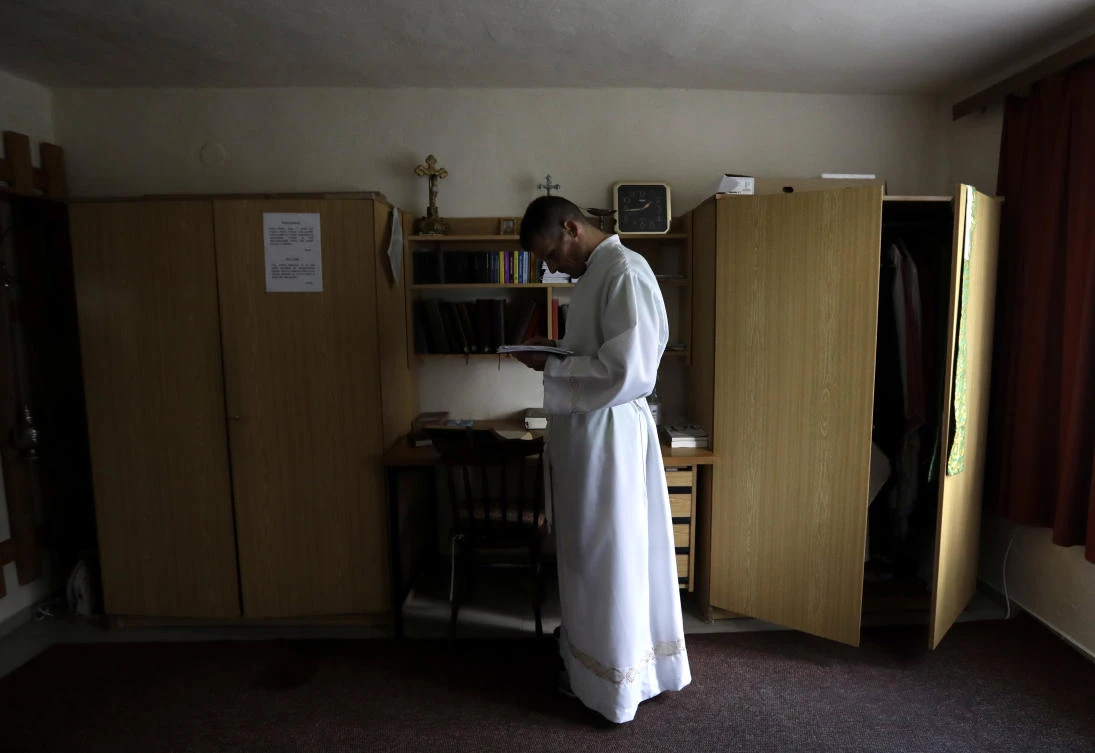 Roman Catholic priest Michal Lajcha dresses to serve a mass in a church in Klak, Slovakia. (AP)