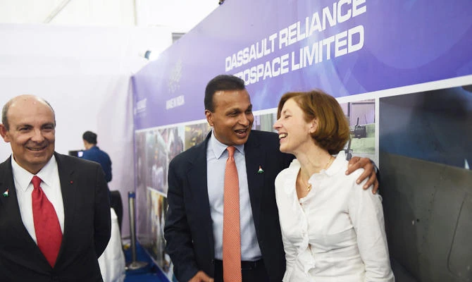 In this file photo taken on October 27, 2017 Chairman and CEO of Dassault Aviation Eric Trappier (L), French Defence Minister Florence Parly (C) and chairman of Reliance Group Anil Ambani arrive at MIHAN SEZ, where she will participates in the foundation stone-laying ceremony of Dassault Reliance Aerospace Limited (DRAL), in Nagpur. (AFP)
