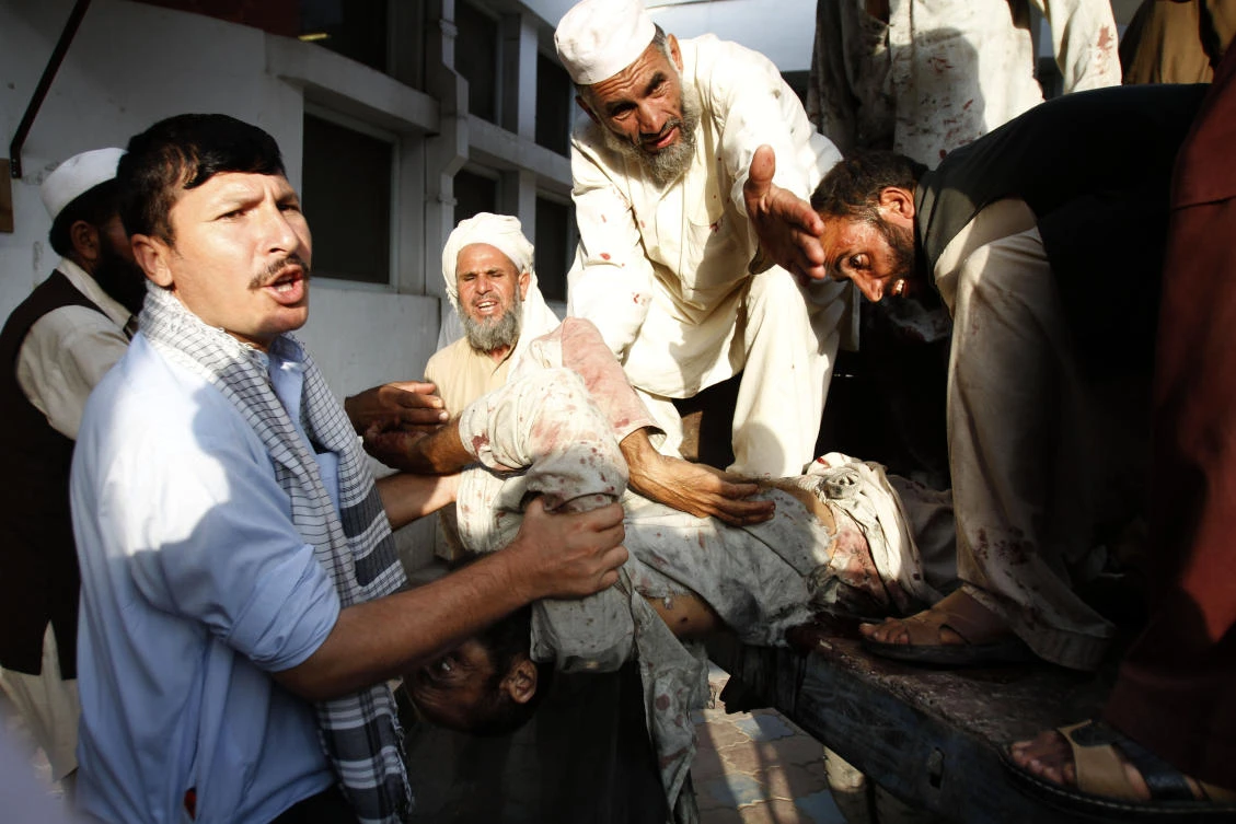 A suicide bombing victim is unloaded from the back of a truck at a hospital in Durbaba district of Jalalabad, east of Kabul. (File/AP)