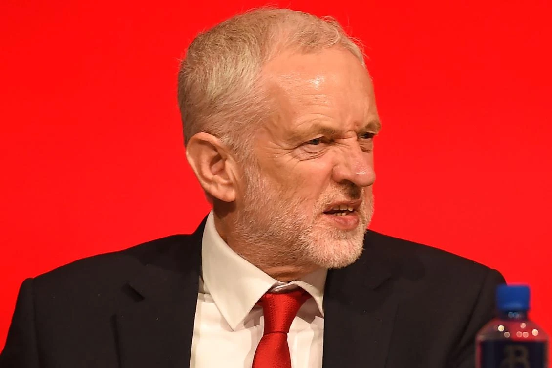Britain's opposition Labour Party leader Jeremy Corbyn on stage at the Labour Party Conference in Liverpool, north west England on September 23, 2018, the official opening day of the annual Labour Party Conference. Britain's Labour Party kicks off its annual conference on Sunday hoping to prove it is ready to unseat the embattled Conservative government despite its own splits on Brexit and rows over anti-Semitism. (AFP)