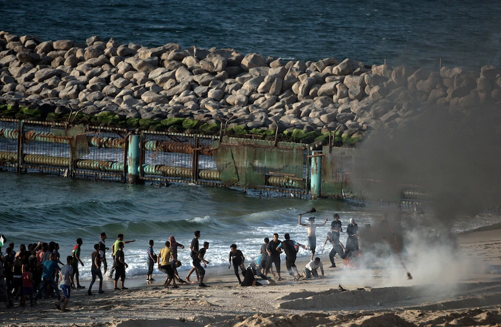 Palestinians protest on the beach at the border with Israel near Beit Lahiya, northern Gaza Strip, Monday, Sept. 24, 2018.(AP)