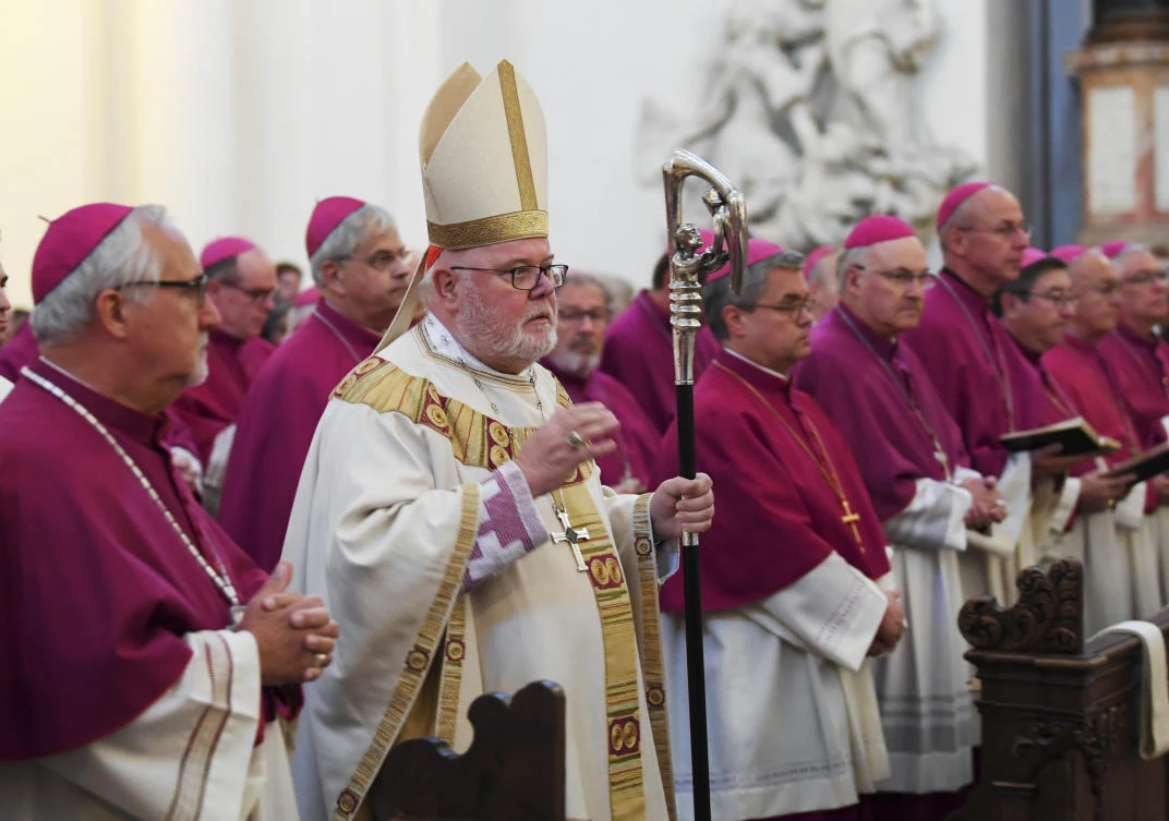 Cardinal Reinhard Marx, center, bishop of Munich and Freising and head of the German Bishops’ Conference, arrives for the opening mass of the bishops’ conference in Fulda, Germany on Tuesday, September 25. (dpa via AP)