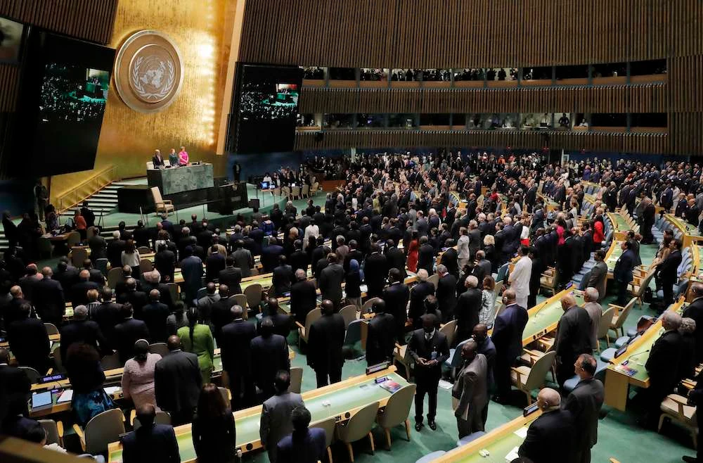 Attendees hold a moment of silence for the late former United Nations Secretary General Annan at the General Assembly in New York. (Reuters)