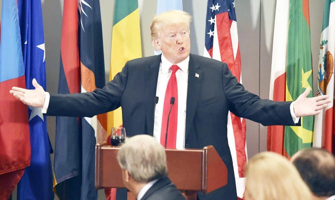 US President Donald Trump during a working luncheon hosted by the UN Secretary-General Antonio Guterres, front, at the United Nations in New York Tuesday. (AFP)