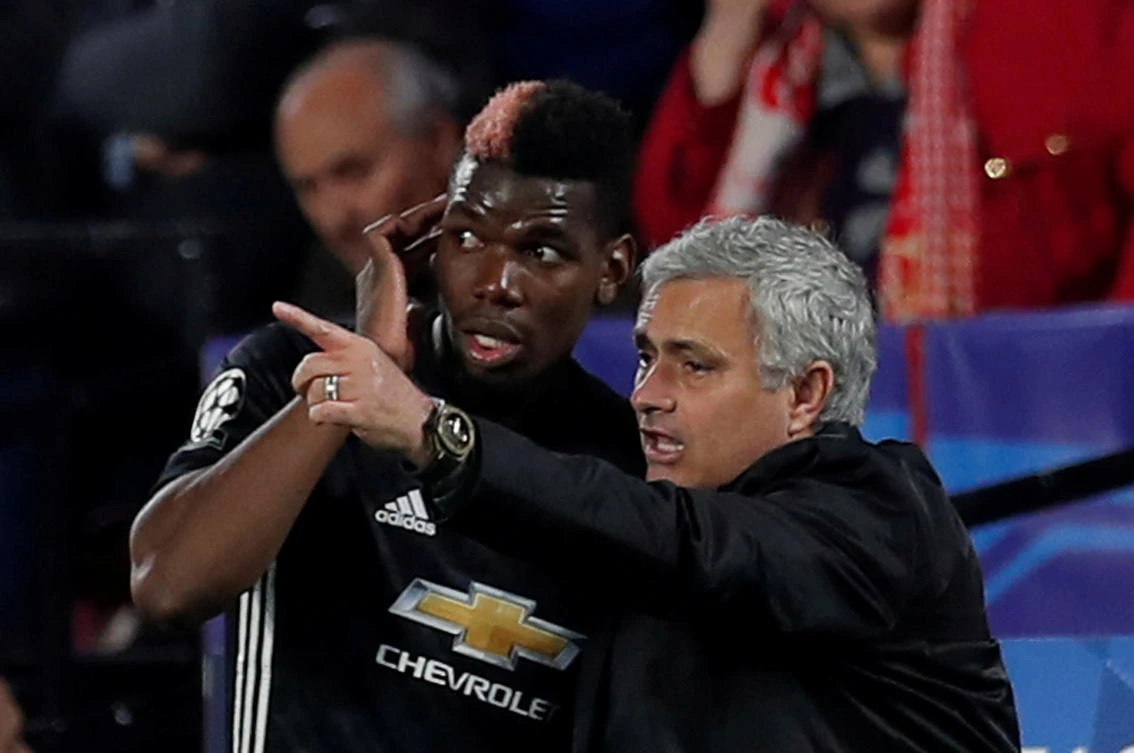 Manchester United manager Jose Mourinho speaks with Paul Pogba during a game in calmer times for the pair. (Action Images via Reuters/File Photo)