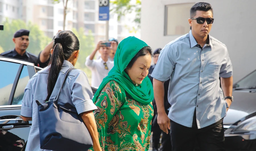 Rosmah Mansor, center, the wife of former Malaysian Prime Minister Najib Razak, arrives at the Malaysian Anti-Corruption Commission (MACC) office in Putrajaya on Wednesday. (AFP)