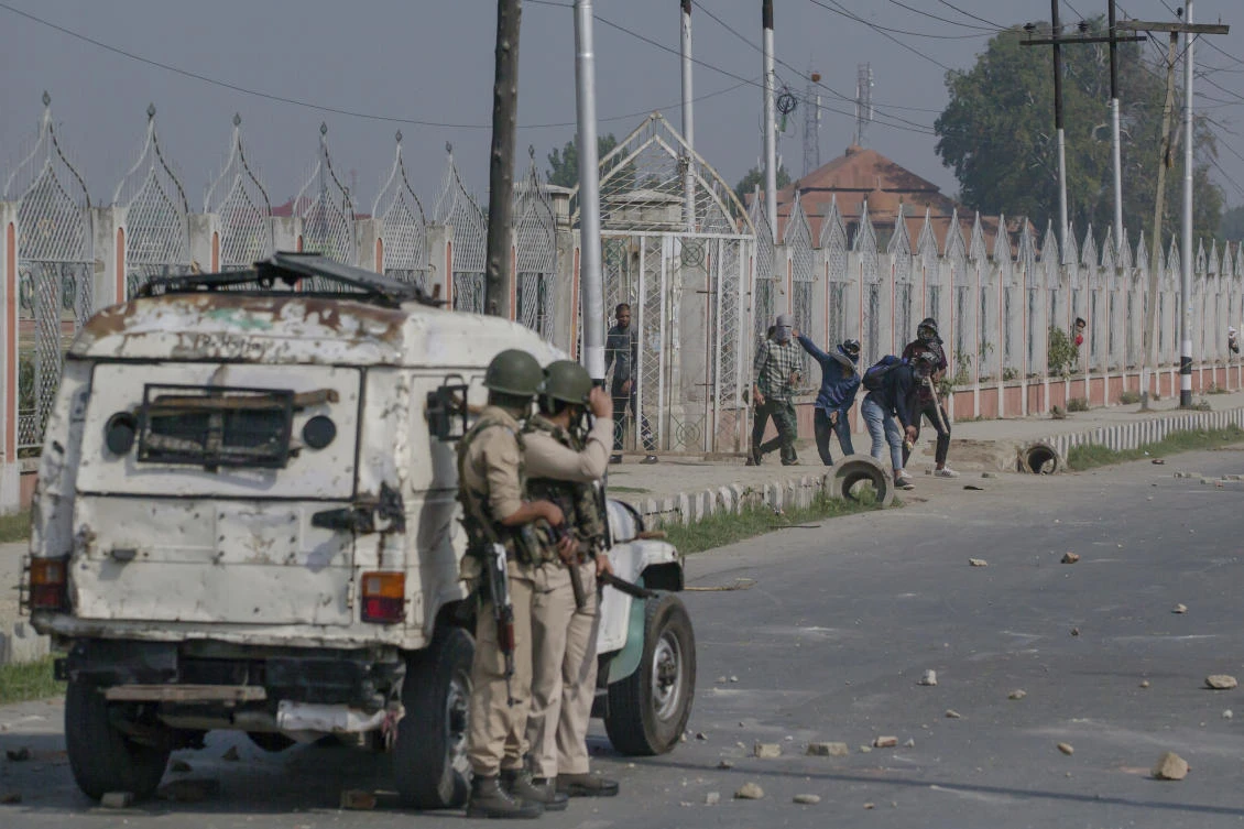 Kashmiri protesters throw stones at Indian police men during a protest against the killing of a civilian in Srinagar, Indian controlled Kashmir on Thursday, September 27. (AP)