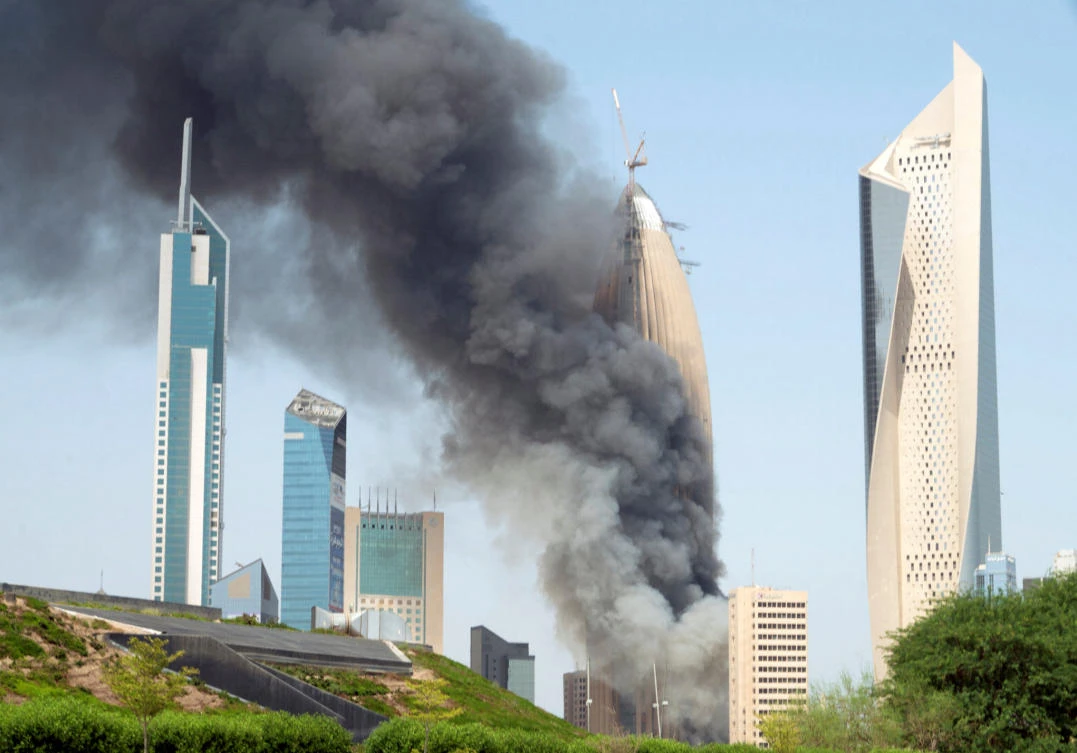 Smoke rises from the construction site of the headquarters of the National Bank of Kuwait, September 27, 2018. (Reuters)