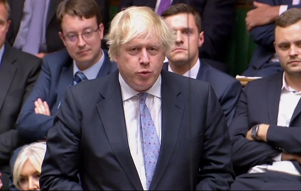 A video grab from footage broadcast by the UK Parliament's Parliamentary Recording Unit (PRU) shows Britain's former Foreign Secretary Boris Johnson as he speaks in the House of Commons in London on July 18, 2018. (AFP)