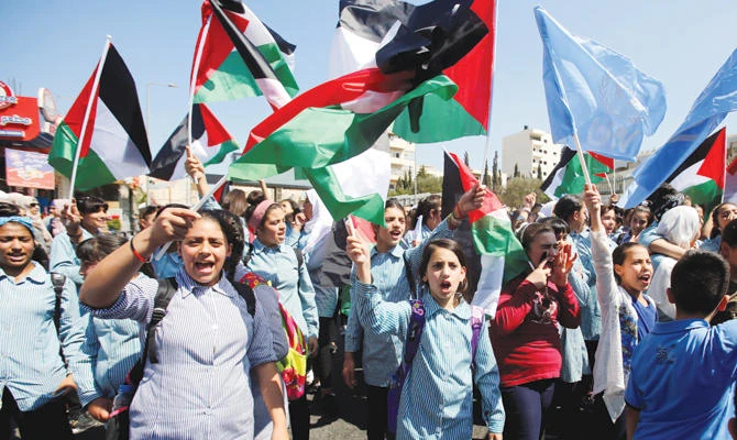 Palestinian schoolgirls take part in a rally in Bethlehem against the US decision to cut funding to the UN Relief and Works Agency. (Reuters)