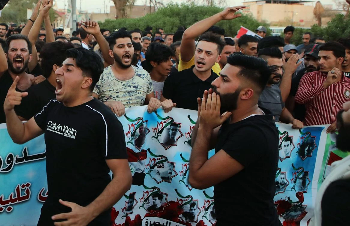 Protesters chant slogans during a demonstration demanding better public services and jobs in Basra, Iraq, Friday, Sept. 28, 2018. (AP)