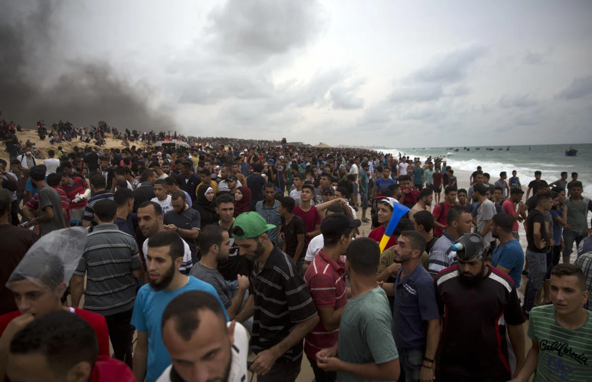 Palestinians protest on the beach at the border with Israel near Beit Lahiya, northern Gaza Strip, Monday, Monday, Oct. 1, 2018. (AP)