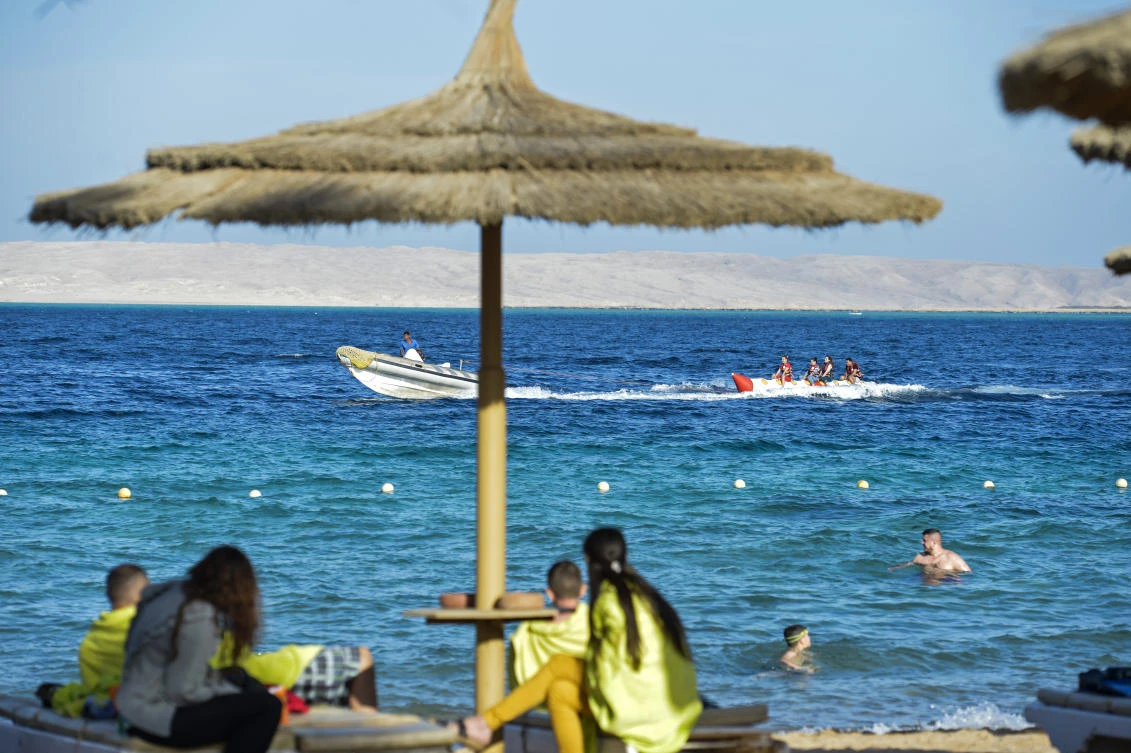 Tourists spend time at the beach in Egypt's Red Sea resort of Hurghada. Egypt is seeing a promising rebound in tourism following devastating terrorist attacks, in welcome news to the government of the president as he seeks re-election this month. (AFP)