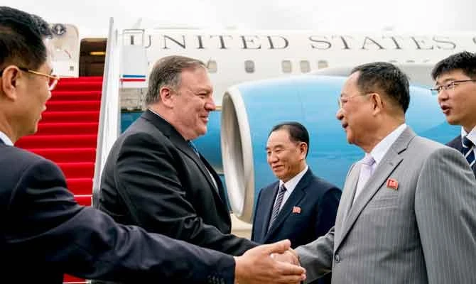 In this July 6, 2018, file photo, US Secretary of State Mike Pompeo, second from left, is greeted by North Korean Director of the United Front Department Kim Yong Chol, center, and North Korean Foreign Minister Ri Yong Ho, second from right, as he arrives at Sunan International Airport in Pyongyang, North Korea. (AP)