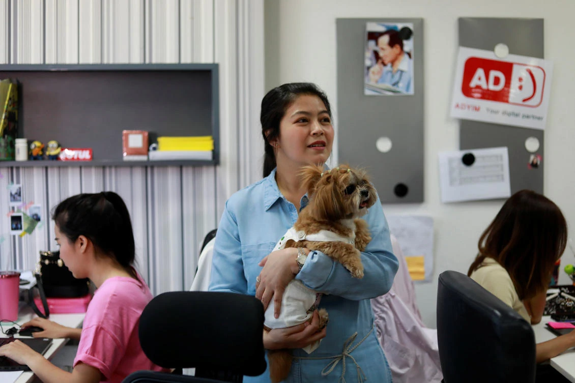 The bring-your-dog-to-work trend is gaining momentum in Thailand, particularly at companies like advertisement firms that are known to require irregular work hours. (Reuters)