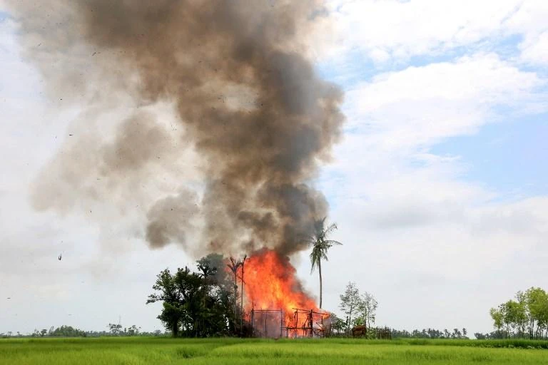 A house burns in Gawdu Tharya village near Maungdaw in Rakhine state in this September 7, 2017 in the aftermath of a Myanmar military response to attacks by Rohingya insurgents. (AFP)