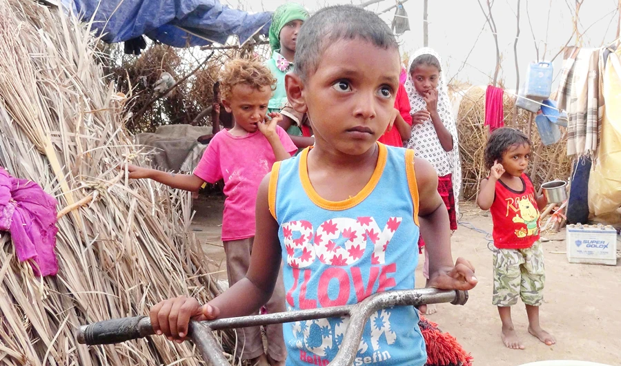 Imad, his sister Alia and friends at Al-Waara camp in Khokha, 30 km from Hays. Their families were forced out of their home after their father was killed in a land mine explosion there. (AFP)