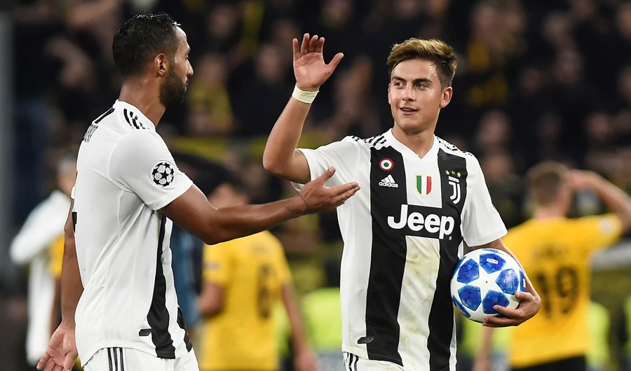 Paulo Dybala, right, stepped up in the Portuguese star’s absence by scoring a hat trick in a 3-0 win to put Juventus top of its group. (Reuters)