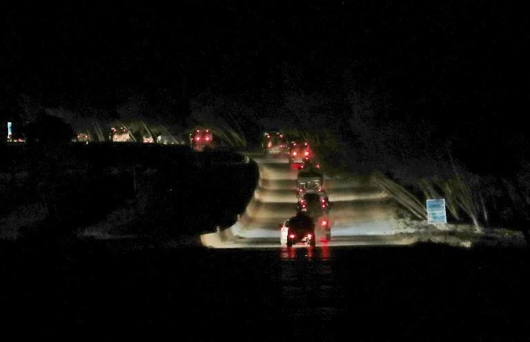 Turkish military vehicles drive in a convoy along the main Damascus-Aleppo highway near the town of Kammari in Syria’s Aleppo province. (AFP)