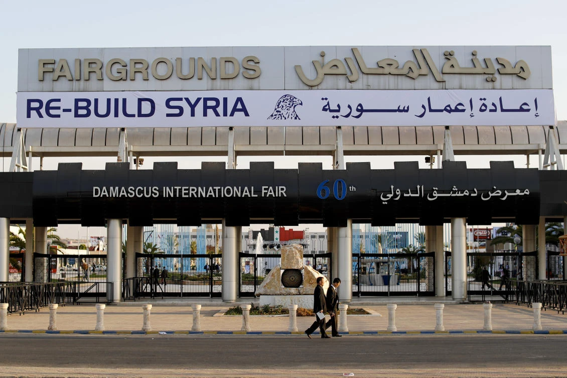 The exhibition is being held at the Damascus International Fairgrounds near the airport, not far from wrecked former rebel strongholds. (AP)