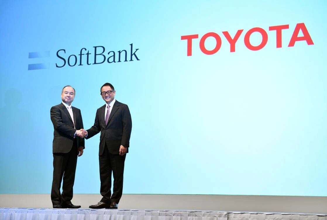 SoftBank Group head Masayoshi Son, left, and Toyota Motor president Akio Toyoda during their joint press conference announcing the creation of a joint venture to provide ‘new mobility services’ including autonomous vehicles for services such as meal deliveries. (AFP)
