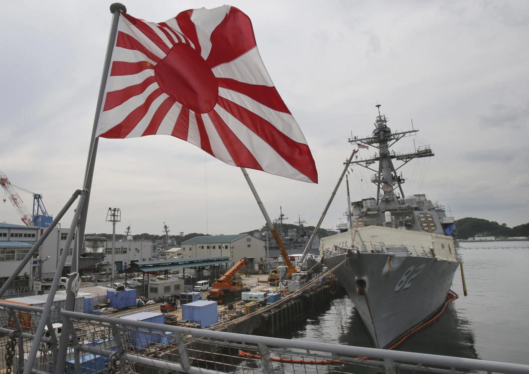 The ‘Rising Sun’ ensign, used by the Japanese Imperial Navy in campaigns around Asia and the Pacific before and during World War Two, was adopted by the Maritime Self-Defense Force in 1954. (AP)