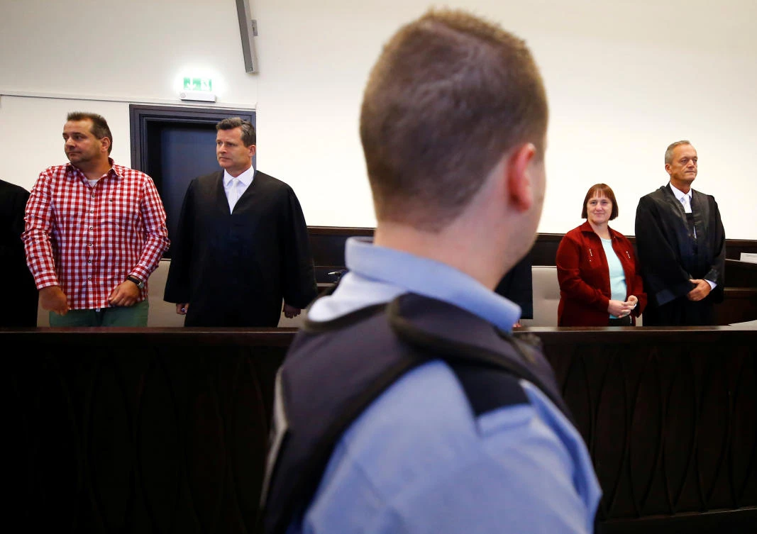 Wilfried Wagener, left and and his former wife Angelika, second right, stand before their verdict is read at a local court in Paderborn, Germany on Friday, October 5. (Reuters)